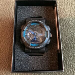 NIB Men’s Burk black and blue sports watch. Water resistant. Has Warranty card